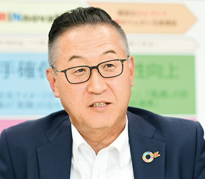 取締役専務執行役員 事業統括本部長 向井 達典の写真